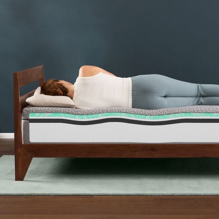 Woman sleeping on memory foam mattress