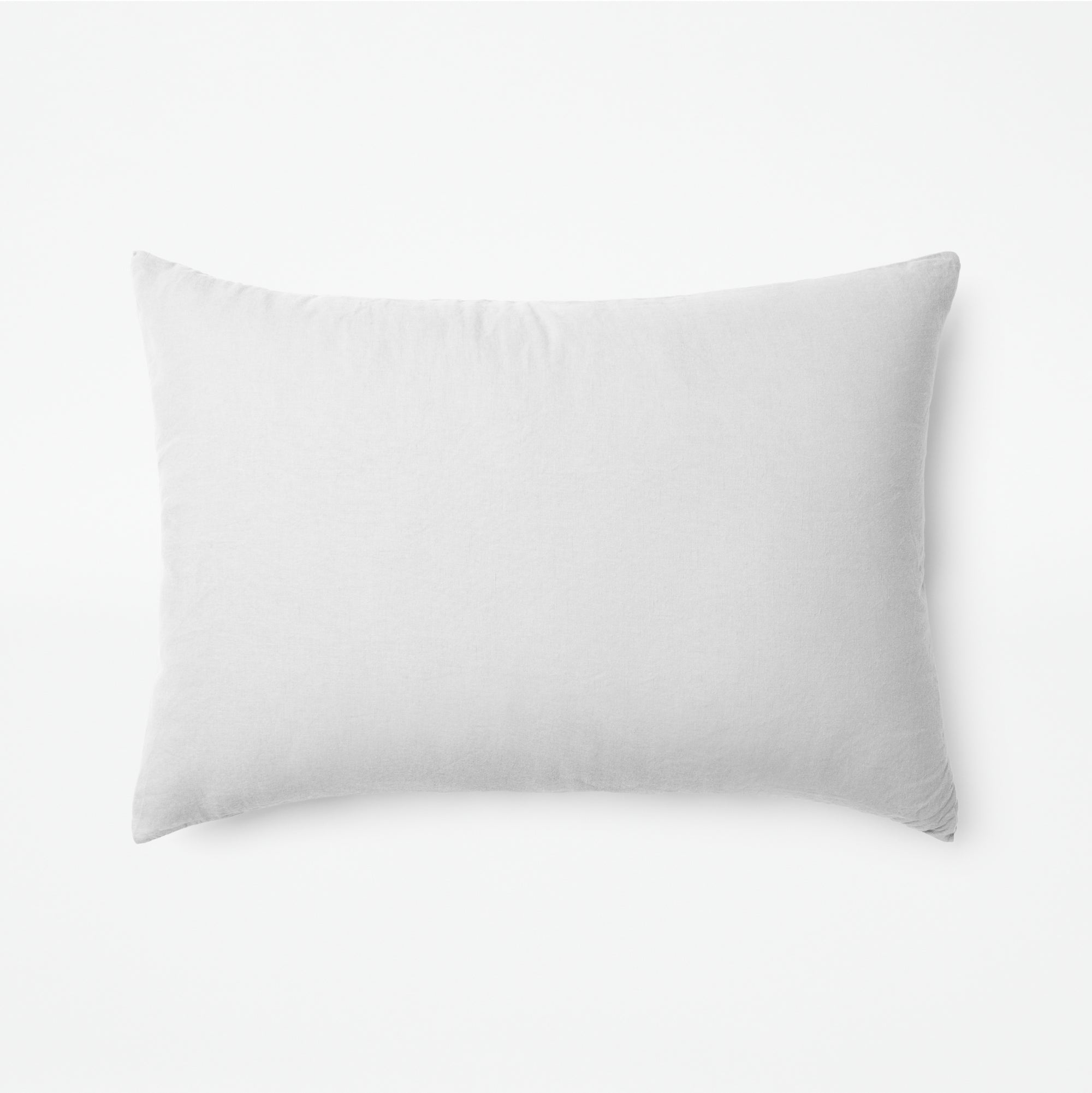 The Tuft and Needle Linen-Cotton Blend Duvet Set, one pillow laying horizontally || color: Cloud