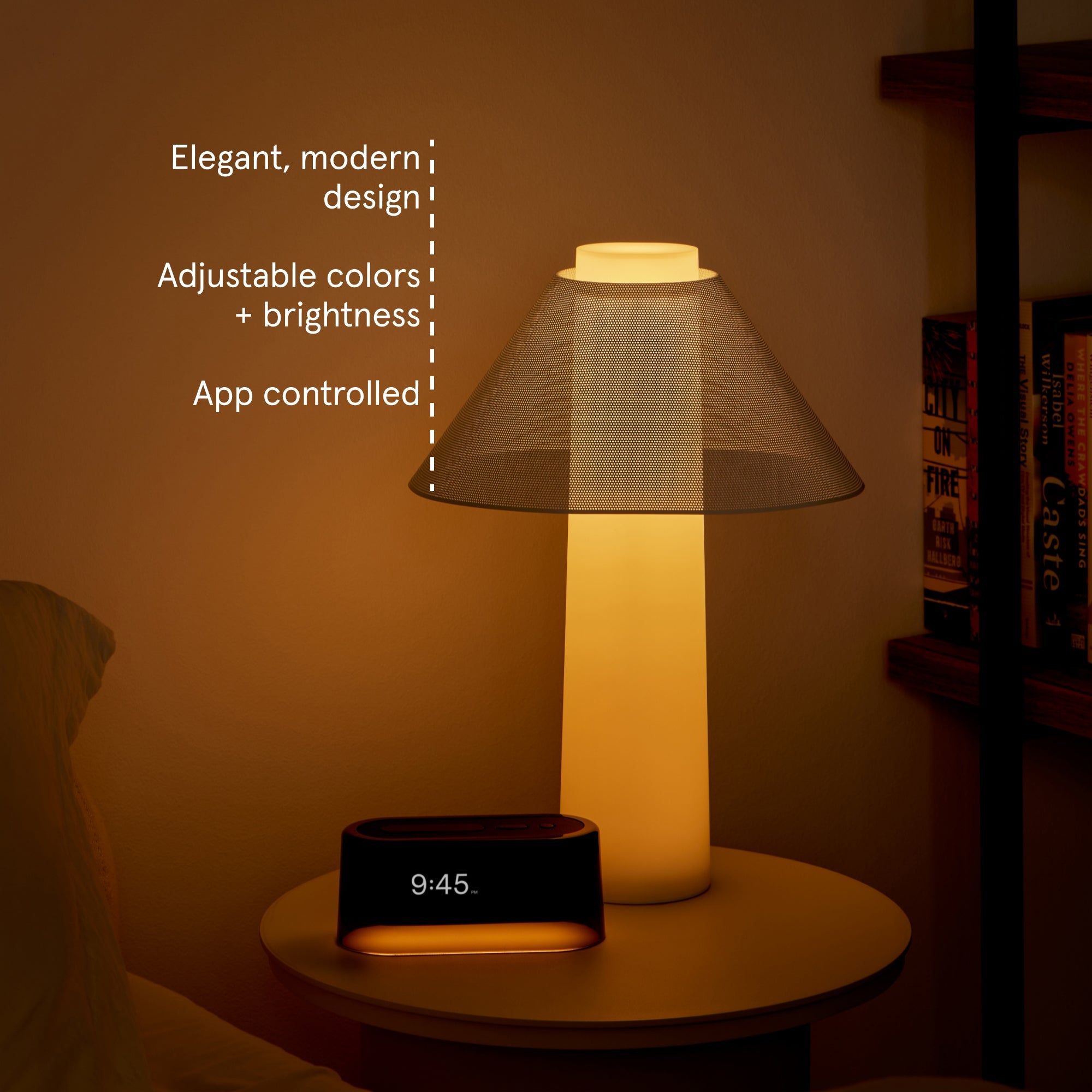 Loftie Lamp siting on a end table in back of a Loftie Smart Alarm Clock with the caption Elegant, modern design. Adjustable colors + brightness. App controlled.