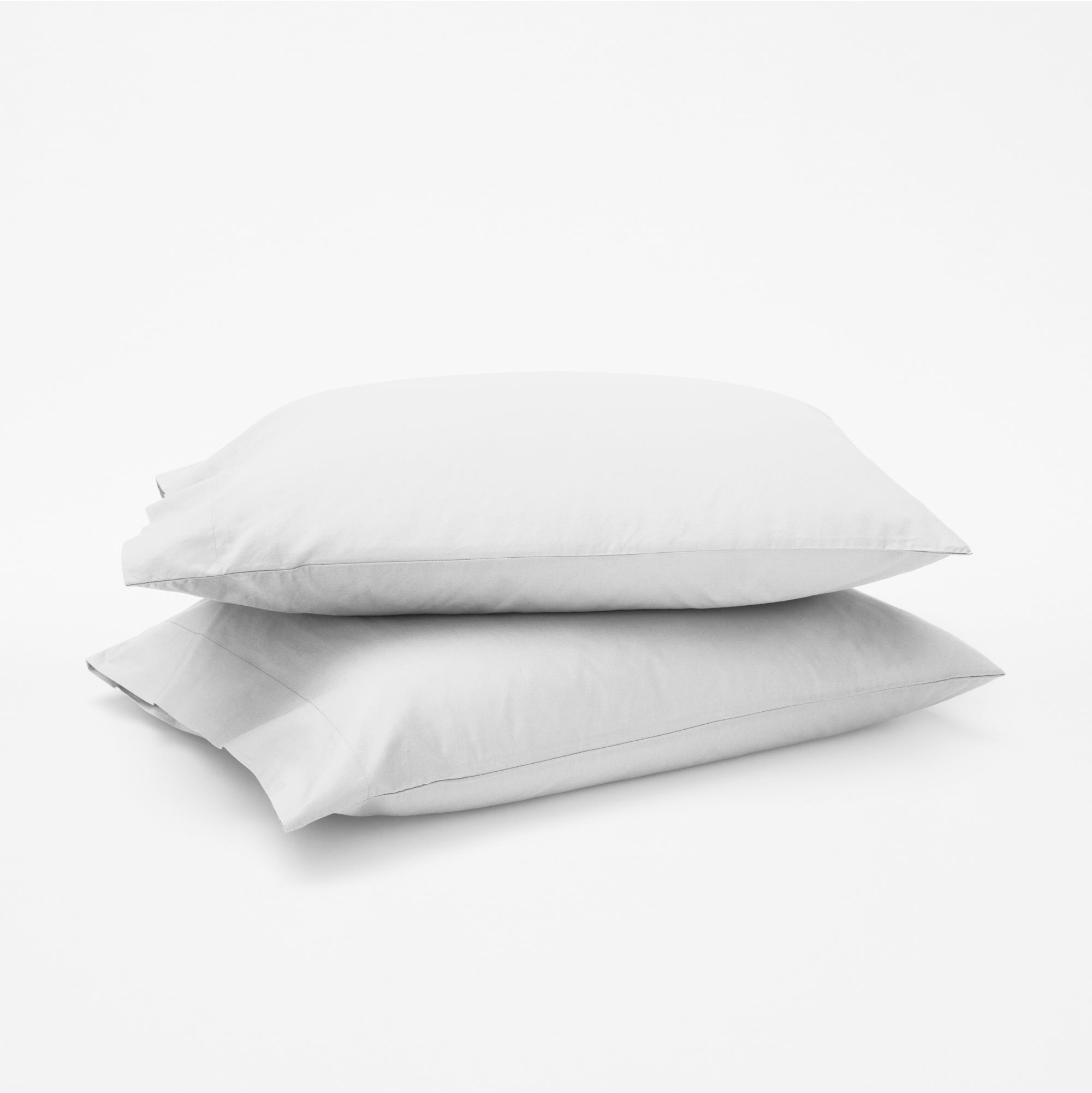 The Tuft and Needle Classic Percale Pillowcase Set, 2 pillows in a pillowcase stacked on top of each other || color: Cloud