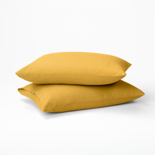 Two pillows dressed in the Tuft and Needle Hemp Pillowcase Set||color:honeycomb